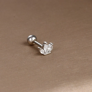 Macro view of crown-shaped stud earring with marquise zircon and screw ball back