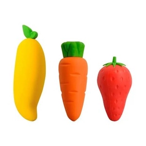 Close-up of mango, carrot and strawberry shaped erasers for kids' stationery