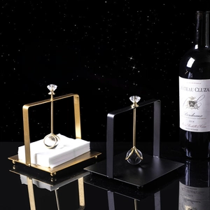 Modern Nordic stainless steel napkin holder with crystal weighted arm in gold and black