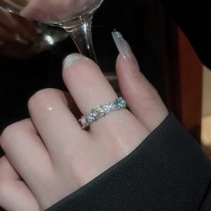 Detailed view of silver rings featuring multi-color oval stones and shimmering zircon accents
