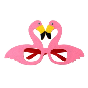 Close-up of pink flamingo felt party glasses with yellow beaks and funny plastic eyes
