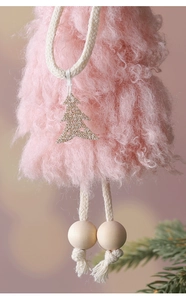 Detail of pink plush angel ornament with golden glitter tree pendant and wooden beads