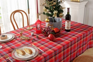Close-up of red and blue plaid Christmas tablecloth with festive fabric texture