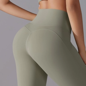 Close-up of high-waist yoga pants in olive green showing lifting seam and fabric texture