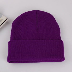 Detailed top-down view of a purple knitted beanie with a classic ribbed texture