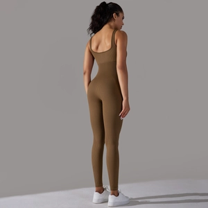 Detail of seamless ribbed brown athletic jumpsuit showing back design and stretch texture