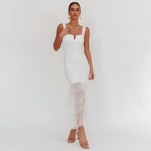 Detail of white V-neck tight dress showing mesh mermaid hem and elegant ruching details
