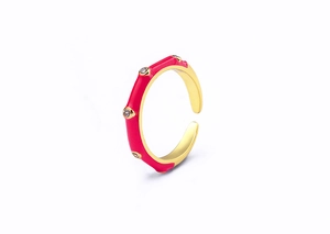 Detail of 18K gold plated ring featuring pink enamel finish and five sparkling zircons