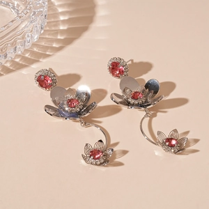 Silver metal floral drop earrings with pink zircons and layered petal fringe design