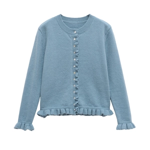 Light blue knit cardigan with ruffle trim and white pearlescent buttons on white backdrop