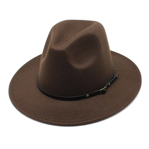 Detail view of dark brown wool fedora hat with black leather strap and gold buckle