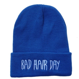 Dark blue knit beanie hat with white Bad Hair Day embroidery in hip-hop street style