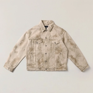 Close-up of khaki denim jacket with vintage paint splatter and heavy canvas texture