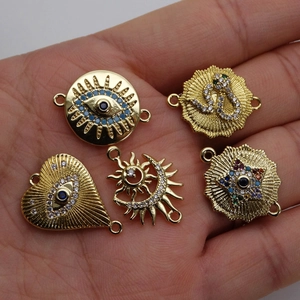 Golden evil eye, snake, and sun moon charm connectors for DIY jewelry making sets
