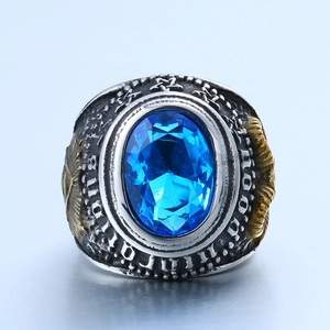 Macro detail of vintage Masonic ring with blue gemstone and golden wing carving
