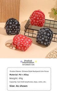 Mini backpack coin purse with Good Luck print, pearl zipper, and gold keychain ring