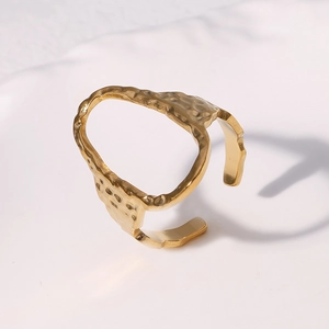 Adjustable golden hammered stainless steel oval open ring with a textured vintage finish