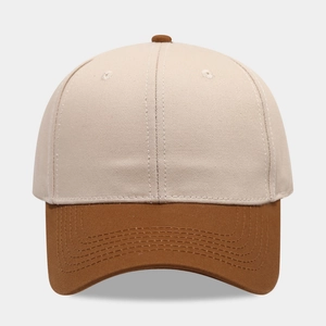 Detailed macro view of the two-tone cotton baseball cap with contrast stitching and eyelets