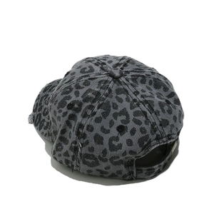 Detail view of the gray leopard print washed denim baseball cap with adjustable back strap