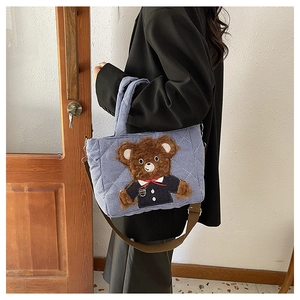 Blue plaid kids tote bag featuring a 3D plush bear detail with a brown shoulder strap