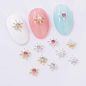 Star-cross nail charms in gold and silver with pink rhinestones and pearls