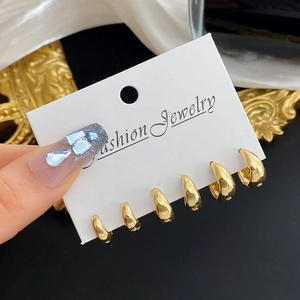 Set of six minimalist gold hoop earrings in graduated sizes for a luxury jewelry look