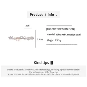 Size chart showing dimensions 2cm x 2.2cm and materials of heart flower resin earrings