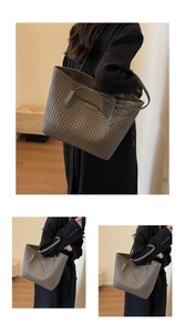 Detailed view of grey woven tote bag featuring high-quality leather texture and large capacity