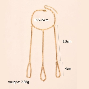 Detailed view of gold hand harness with star sequins and chain length specifications