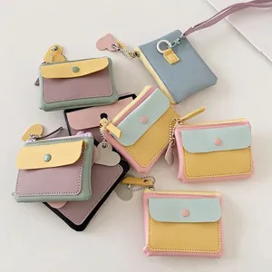 Colorful macaron-style faux leather coin purse with snap button and heart pendant