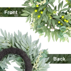 Detail view showing front greenery and back woven rattan of the olive berry wreath