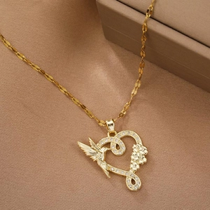 Golden heart pendant necklace featuring a hummingbird and flowers with sparkling crystals