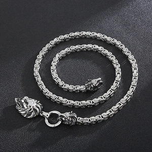 Detail of silver shield lion head pendant with heavy Byzantine chain link for men