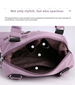 Detail view of purple nylon tote bag interior with zipper pocket and open slots