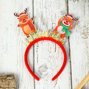 Close-up of a festive red reindeer Christmas headband with tinsel and a mini hat