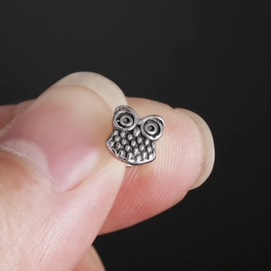 Silver stainless steel owl stud earring with vintage finish and detailed texture