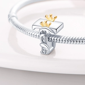 Detailed view of silver letter I bead with gold crown and crystals on snake chain