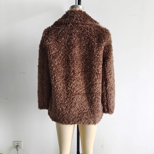 Back view of a coffee brown faux fur jacket with fluffy plush texture on a mannequin