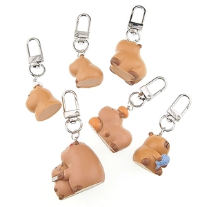 Set of cute 3D resin Capybara keychains in various poses on a white background