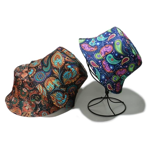 Ethnic paisley print bucket hats in black and blue patterns for summer sun protection