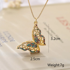 Macro shot of 18k gold plated butterfly tree pendant necklace with colorful zircons