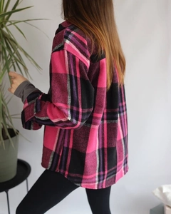 Rear view of a loose-fitting pink plaid wool shacket with a classic dropped shoulder fit