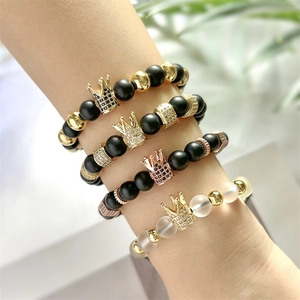 Men's braided beaded bracelets with copper micro-pave crown charm and black matte beads