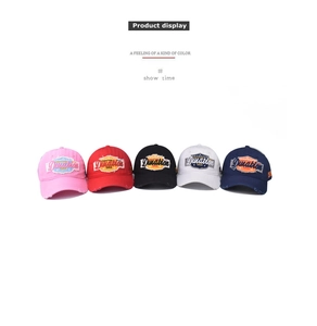 Row of vintage washed cotton baseball caps with Duration 1968 embroidered patches