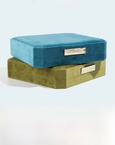 Detail view of velvet jewelry boxes with octagonal corners and gold fashion plates