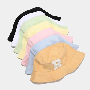 Collection of colorful terry cloth bucket hats with 3D R-letter patch for a casual look