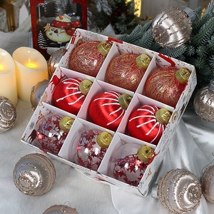 Set of 9 festive Christmas balls in gold and red with star sequins in a gift box