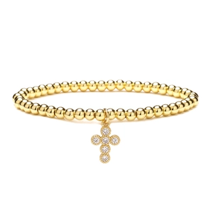 4mm gold bead bracelet featuring a cross pendant with white cubic zirconia stones
