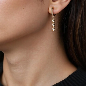 Elegant gold stainless steel tassel earrings with cubic zirconia and crystal drops
