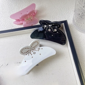 Medium size acetate bow hair claw clips with rhinestones in black white and pink